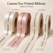 Load image into Gallery viewer, Four rolls of custom printed satin and cotton ribbons displayed on a warm beige background. The ribbons include cream satin, blush pink satin, cream cotton, and natural cotton, all printed with elegant text such as 'YOUR BRAND', 'MADE WITH LOVE', 'HANDMADE FOR YOU', and 'THANK YOU'.
